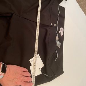 Calvin Klein traditional fit two button black straight leg dress pants.